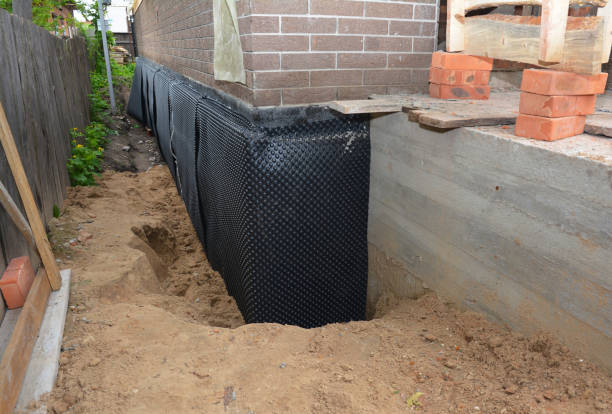 Happy homeowners after waterproofing job in Oregon